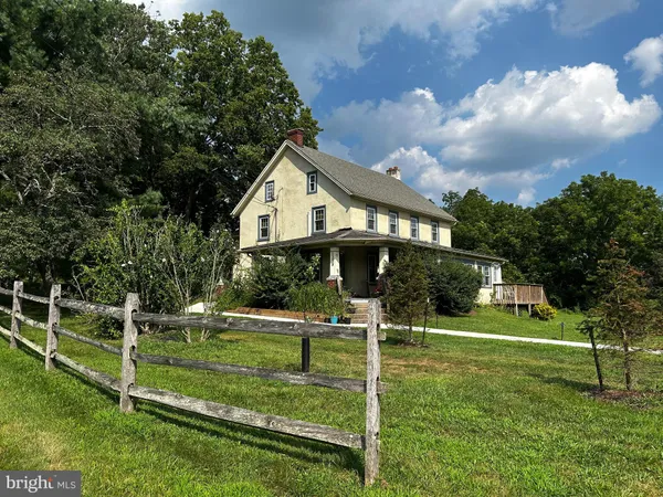 a view of a house with a big yard