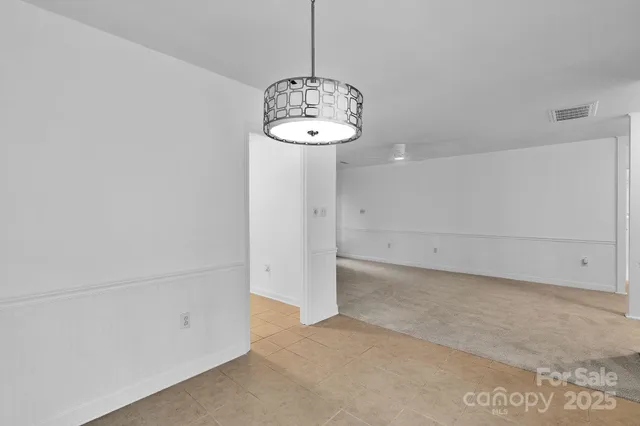 a view of a room with an empty space