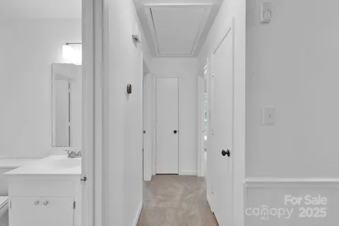 a view of a bathroom from the hallway