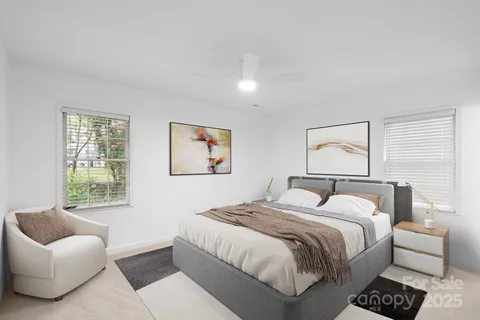 a bedroom with a bed and a couch