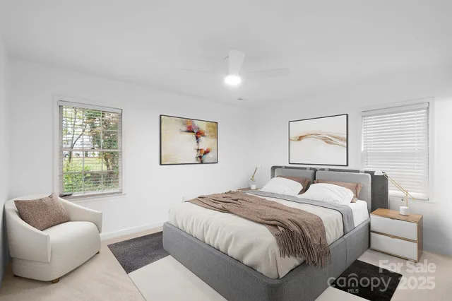 a bedroom with a bed and a couch