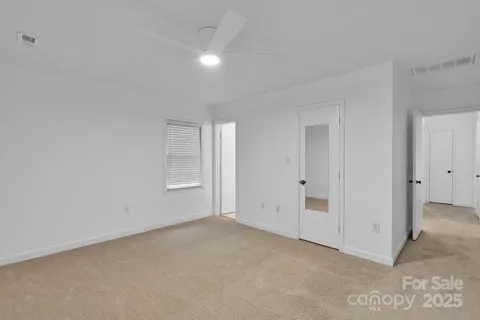 a view of an empty room and entryway