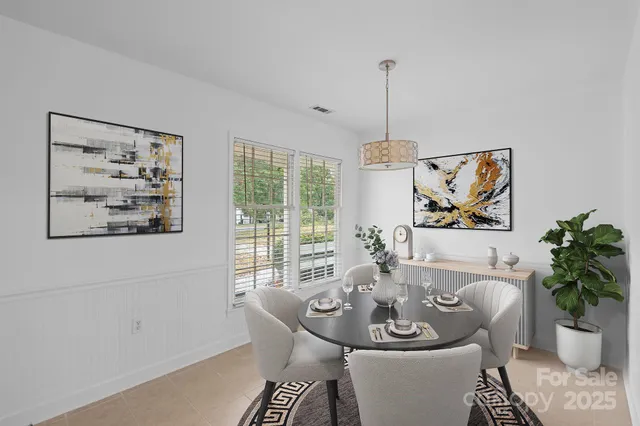 a dining room with furniture and window