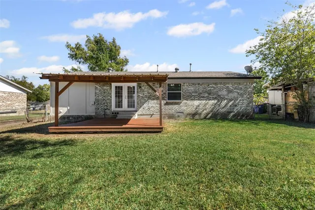 front view of a house with a big yard