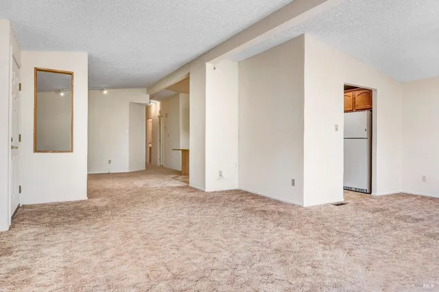 a kitchen with stainless steel appliances granite countertop a refrigerator and a stove
