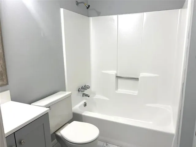 an empty room with wooden floor