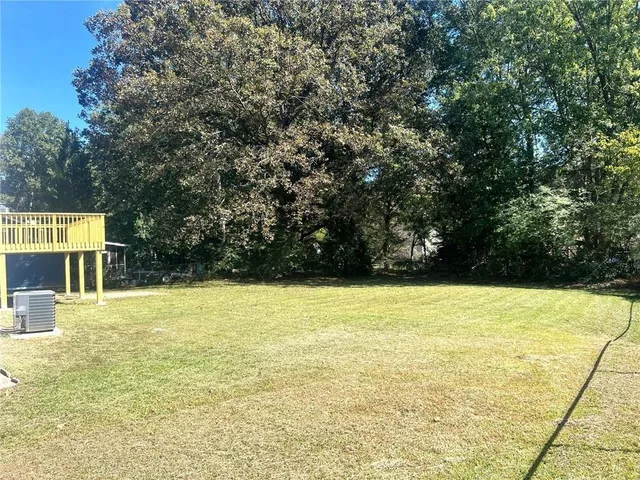 a view of a swimming pool with an outdoor space and seating area