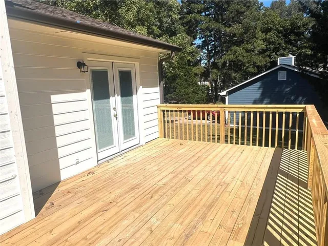 a bathroom with a toilet and a mirror
