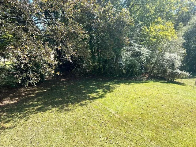a backyard of a house with lots of green space
