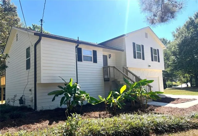 a house view with a backyard space