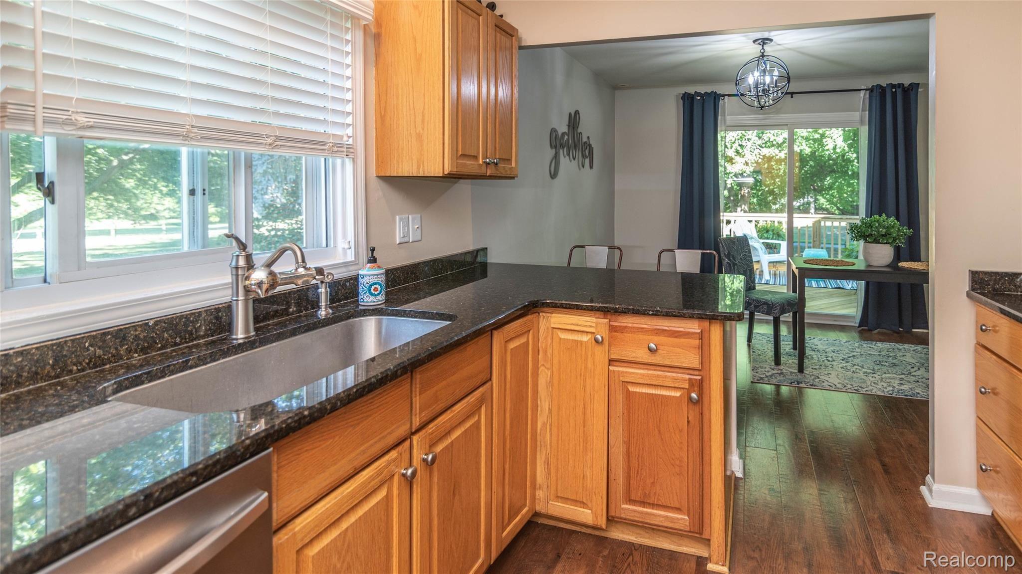1981 Roxbury Run Wixom, MI 48393 - Photo 25 of 57 KITCHEN TO DINING AREA