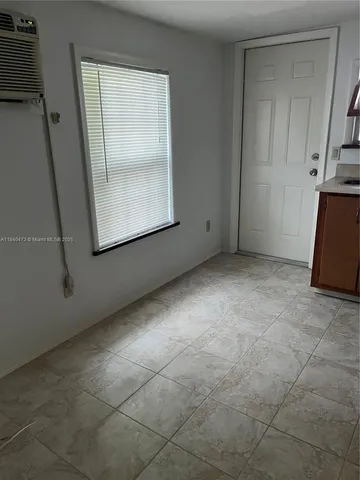 a white toilet sitting next to a bath tub