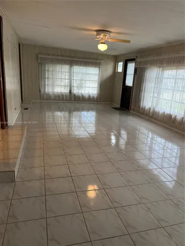 a view of an empty room and window