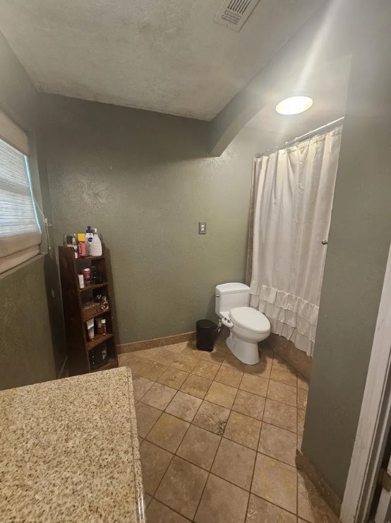 207 Thorn Ridge Street Bridge City, TX 77611 - Photo 11 of 19 a bathroom with a toilet and a sink