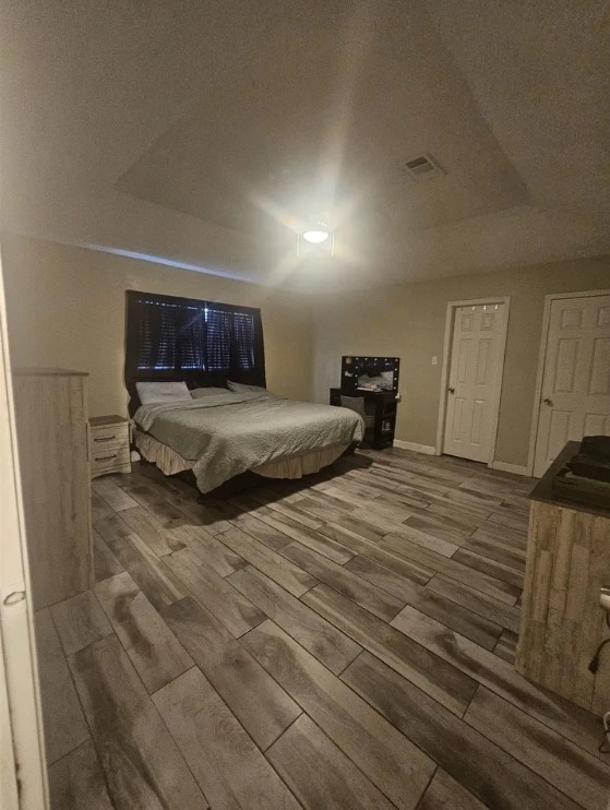 207 Thorn Ridge Street Bridge City, TX 77611 - Photo 8 of 19 a bedroom with a bed and window