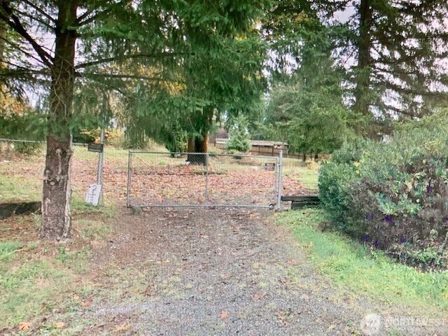 21422 184th Avenue Southeast Renton, WA 98058 - Photo 1 of 4 a view of a yard with plants and trees