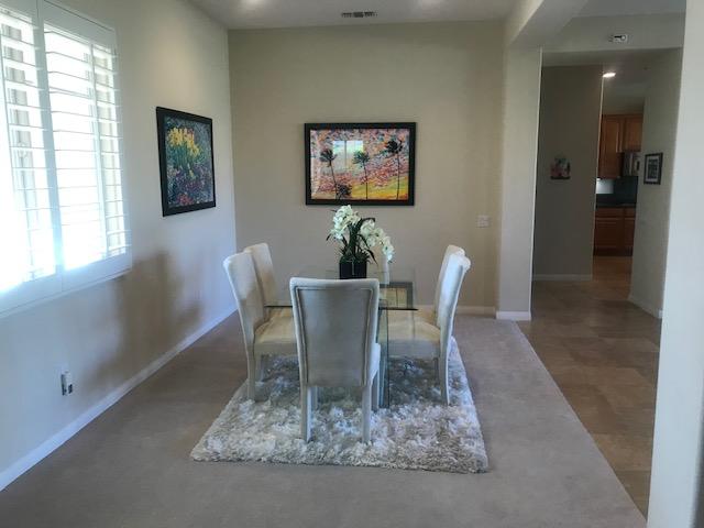 81194 Avenida Sombra Indio, CA 92203 - Photo 11 of 24 a dining room with furniture and window