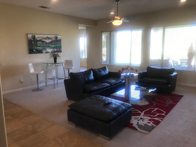 81194 Avenida Sombra Indio, CA 92203 - Photo 12 of 24 a living room with furniture and a large window