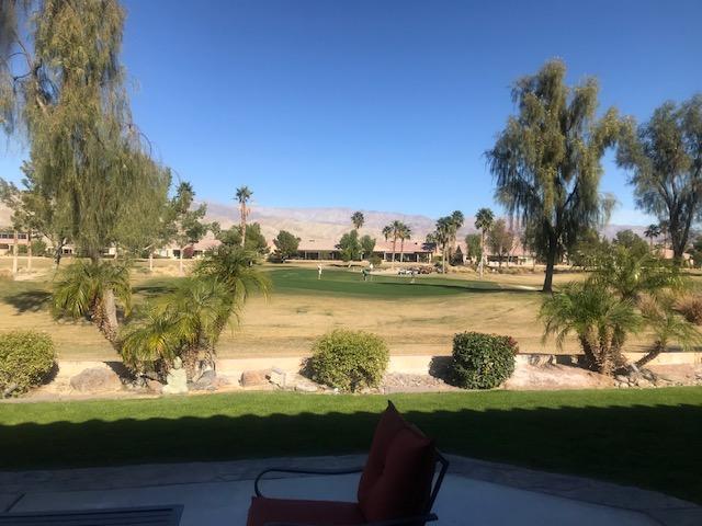 81194 Avenida Sombra Indio, CA 92203 - Photo 2 of 24 a view of a lake with lawn chairs