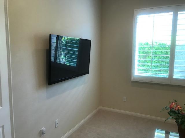 81194 Avenida Sombra Indio, CA 92203 - Photo 21 of 24 a room with a window and a fan