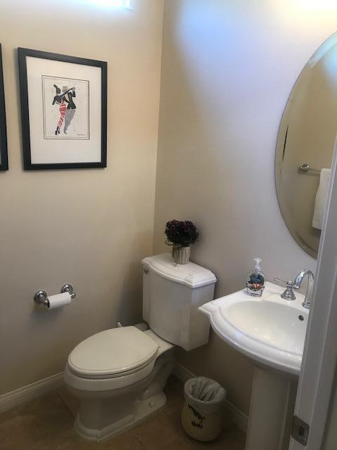 81194 Avenida Sombra Indio, CA 92203 - Photo 23 of 24 a bathroom with a toilet sink and mirror