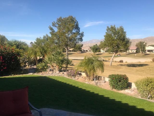 81194 Avenida Sombra Indio, CA 92203 - Photo 4 of 24 a view of a lake with a yard