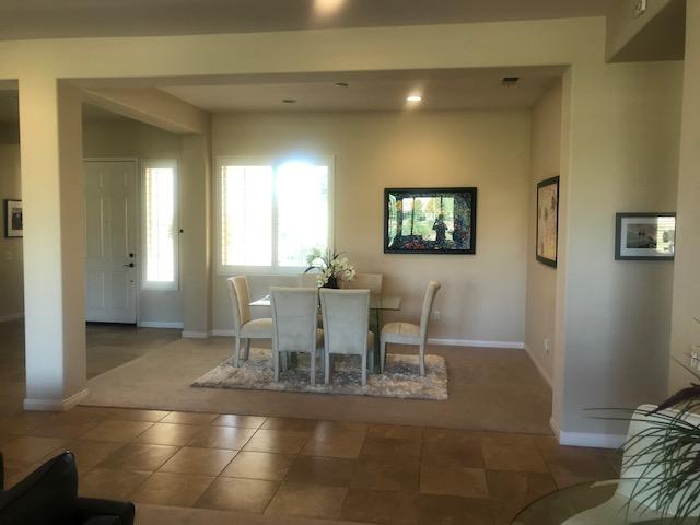 81194 Avenida Sombra Indio, CA 92203 - Photo 10 of 24 a dining room with furniture and window