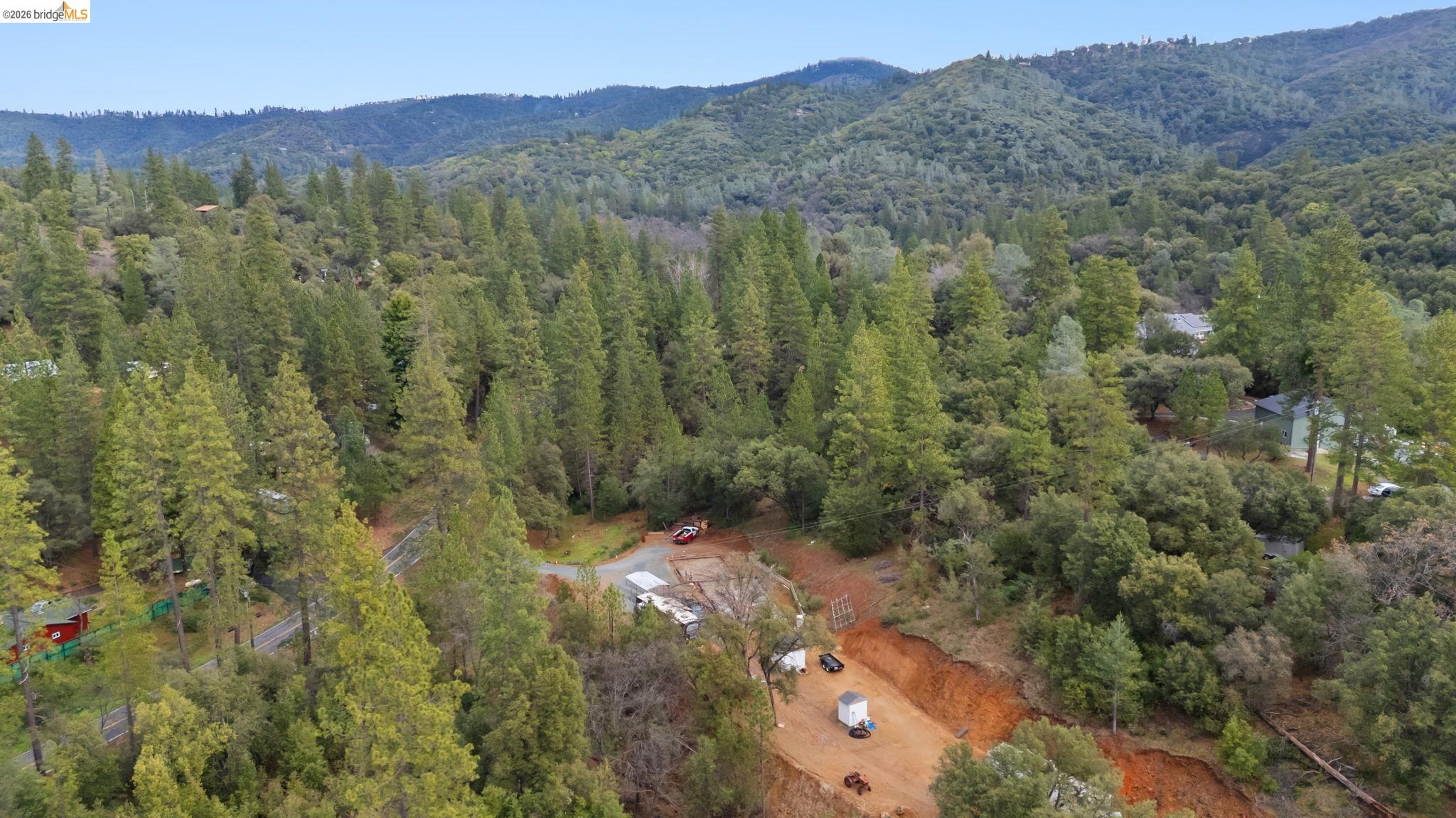 21901 Sawmill Flat Road Sonora, CA 95370 - Photo 12 of 24 a view of a forest with a mountain and trees