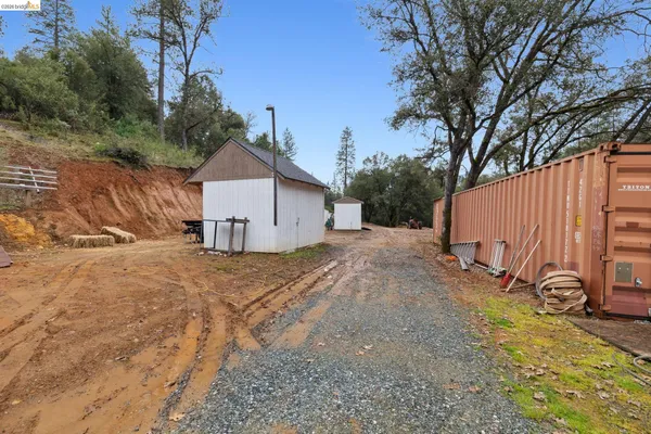 a backyard of a house with a yard and garage
