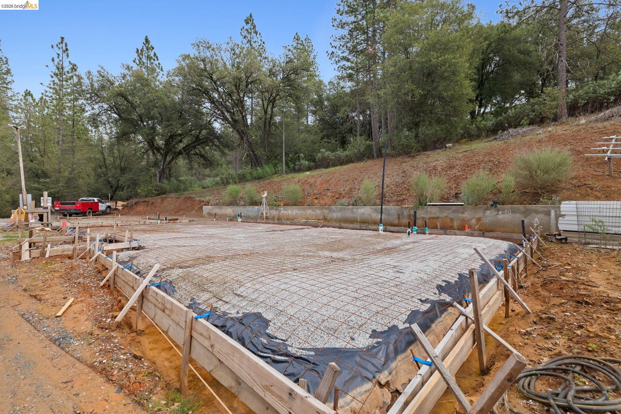 21901 Sawmill Flat Road Sonora, CA 95370 - Photo 8 of 24 a wooden bench sitting on top of a wooden floor