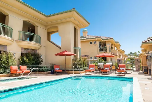 a outdoor space with lots of swings and slides