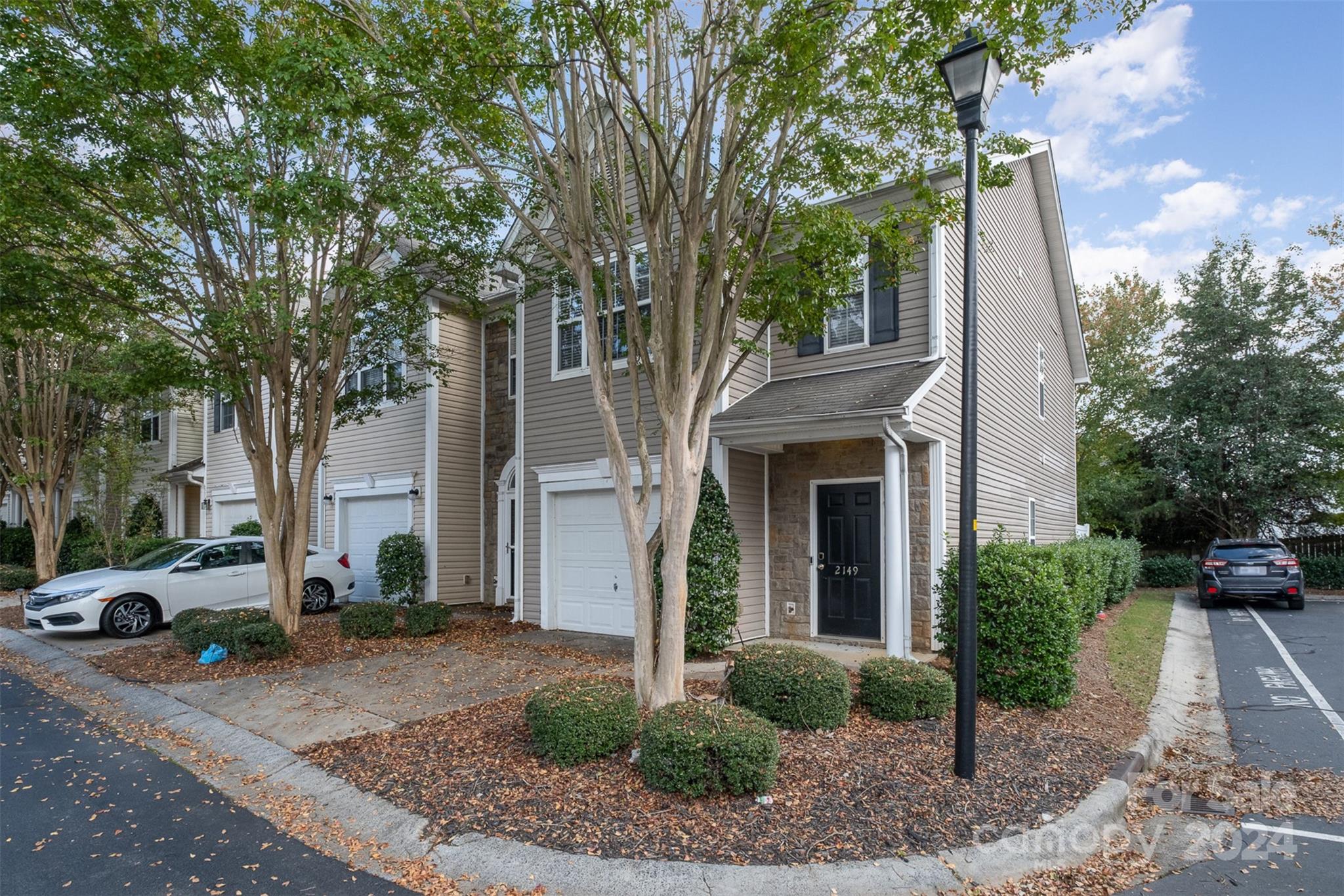 2149 Midnight Blue Lane Fort Mill, SC 29708 - Photo 1 of 30 a front view of a house with garden