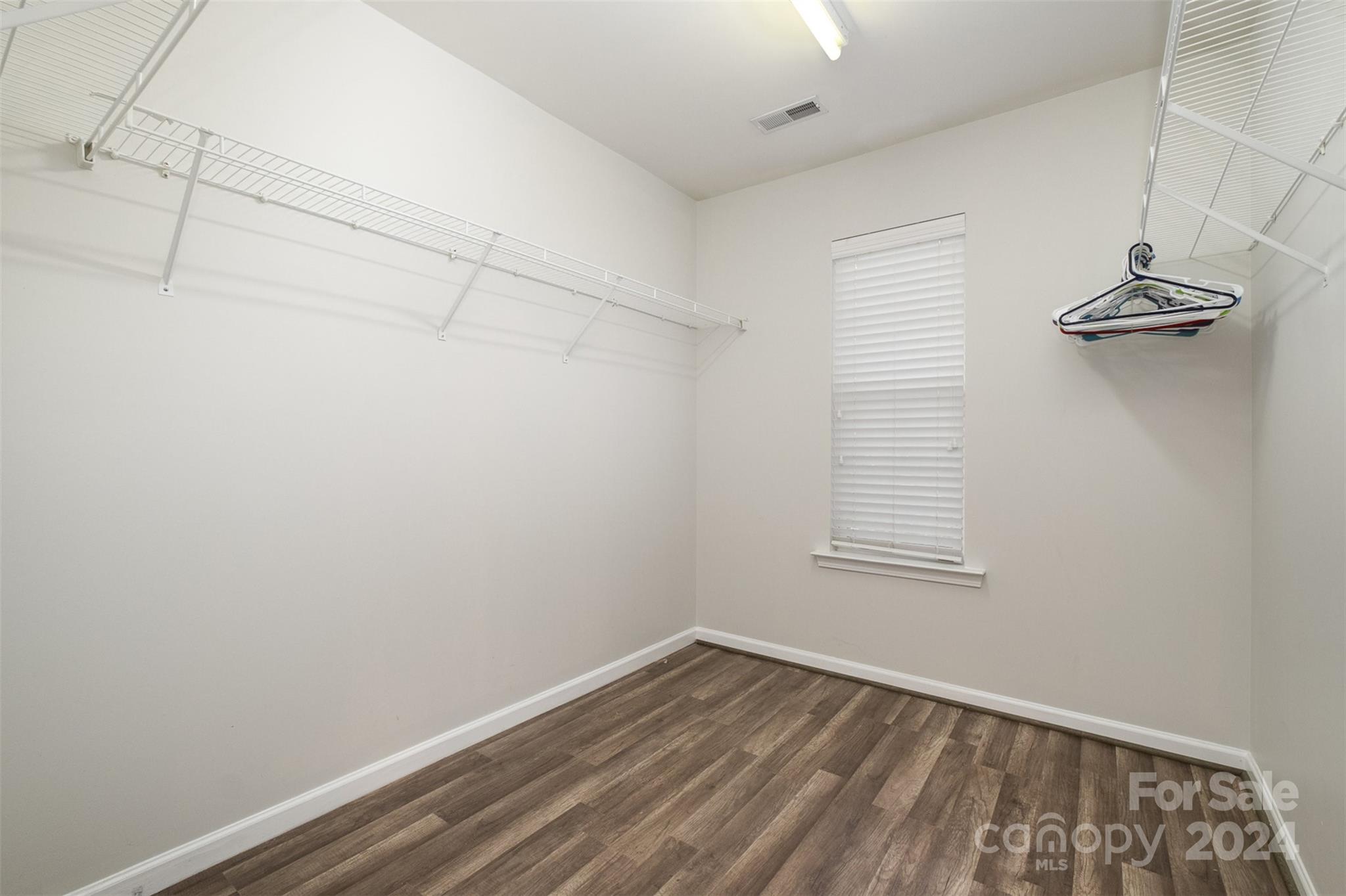 2149 Midnight Blue Lane Fort Mill, SC 29708 - Photo 21 of 30 a view of a room with rack on the wall and a window