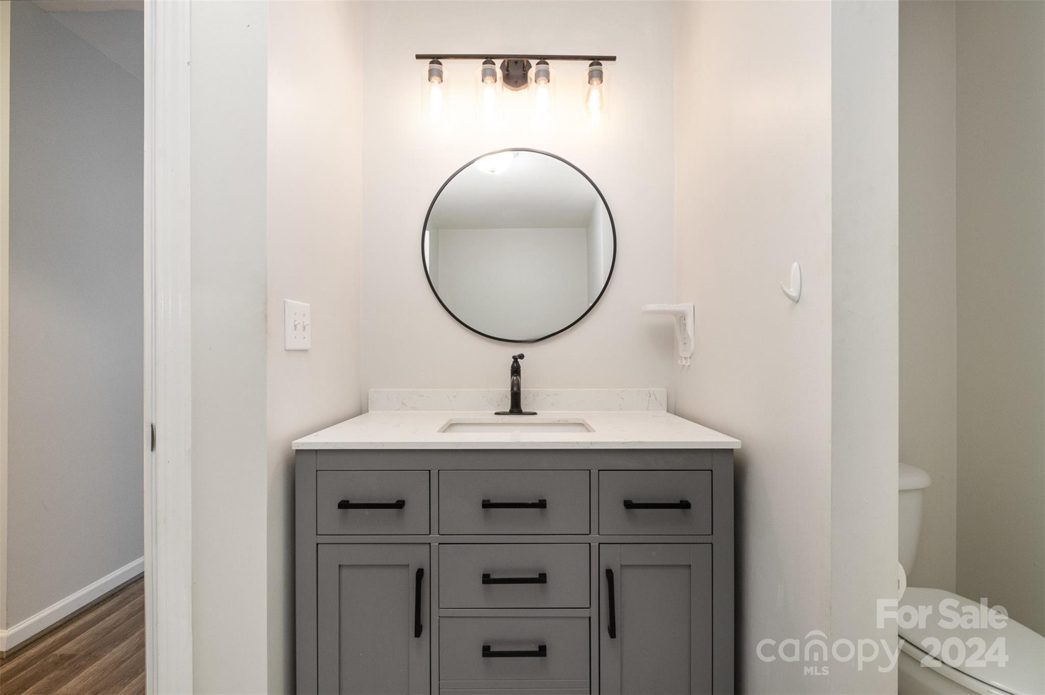 2149 Midnight Blue Lane Fort Mill, SC 29708 - Photo 22 of 30 a bathroom with a sink a vanity and a mirror