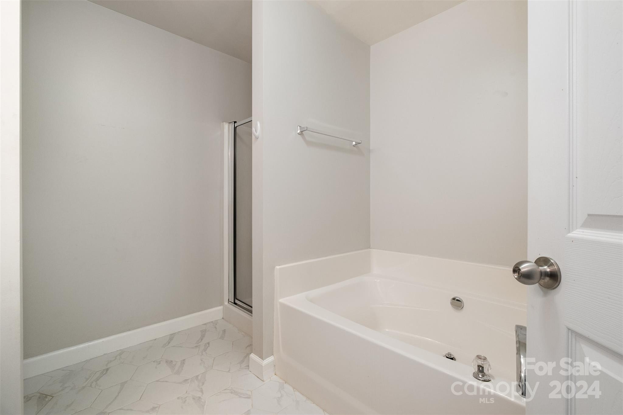 2149 Midnight Blue Lane Fort Mill, SC 29708 - Photo 24 of 30 a white bath tub sitting next to a shower