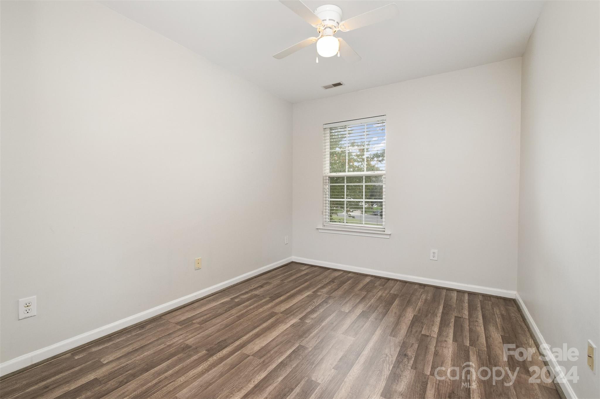 2149 Midnight Blue Lane Fort Mill, SC 29708 - Photo 25 of 30 wooden floor in an empty room with a window