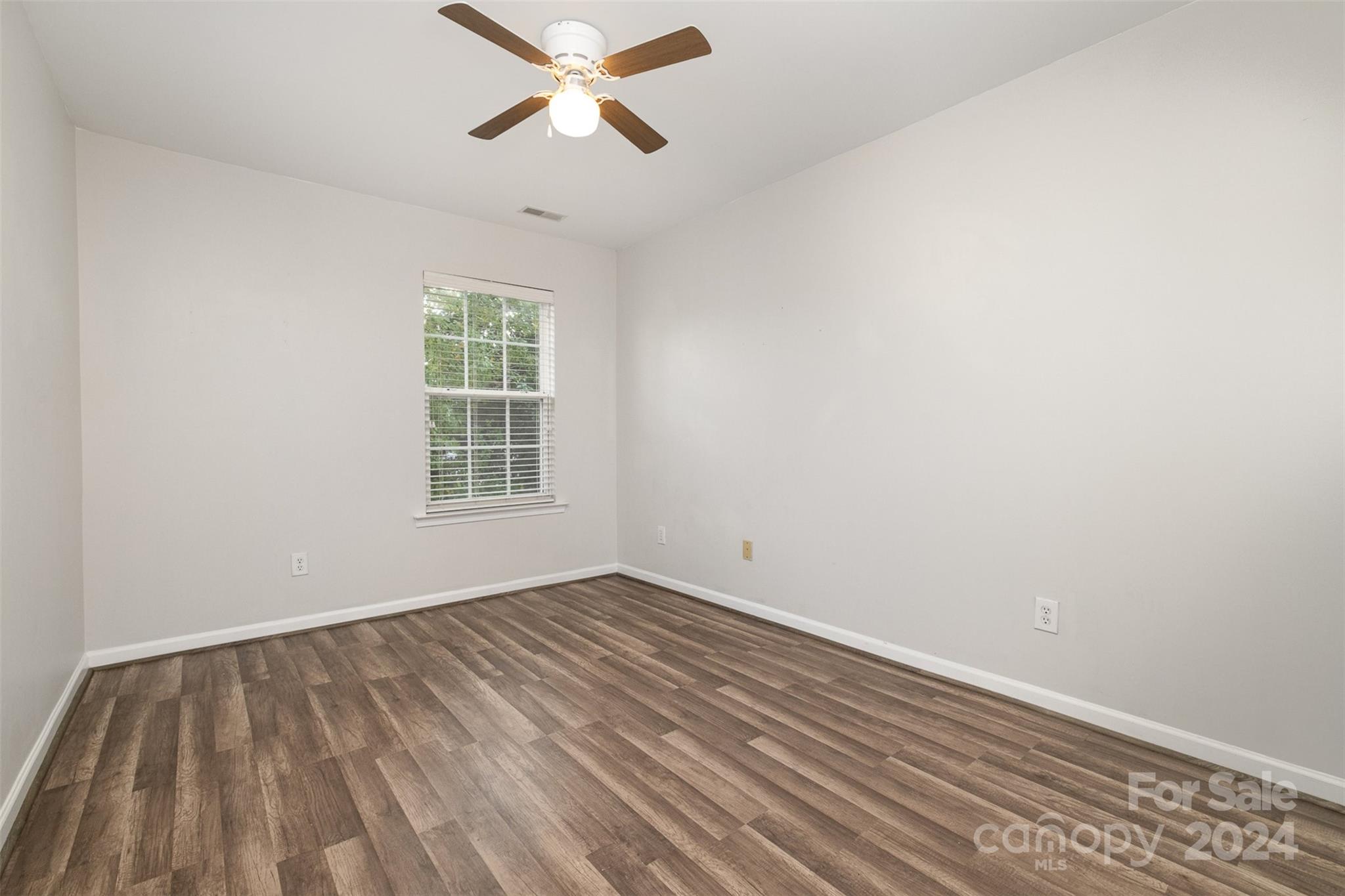 2149 Midnight Blue Lane Fort Mill, SC 29708 - Photo 26 of 30 wooden floor in an empty room with a window
