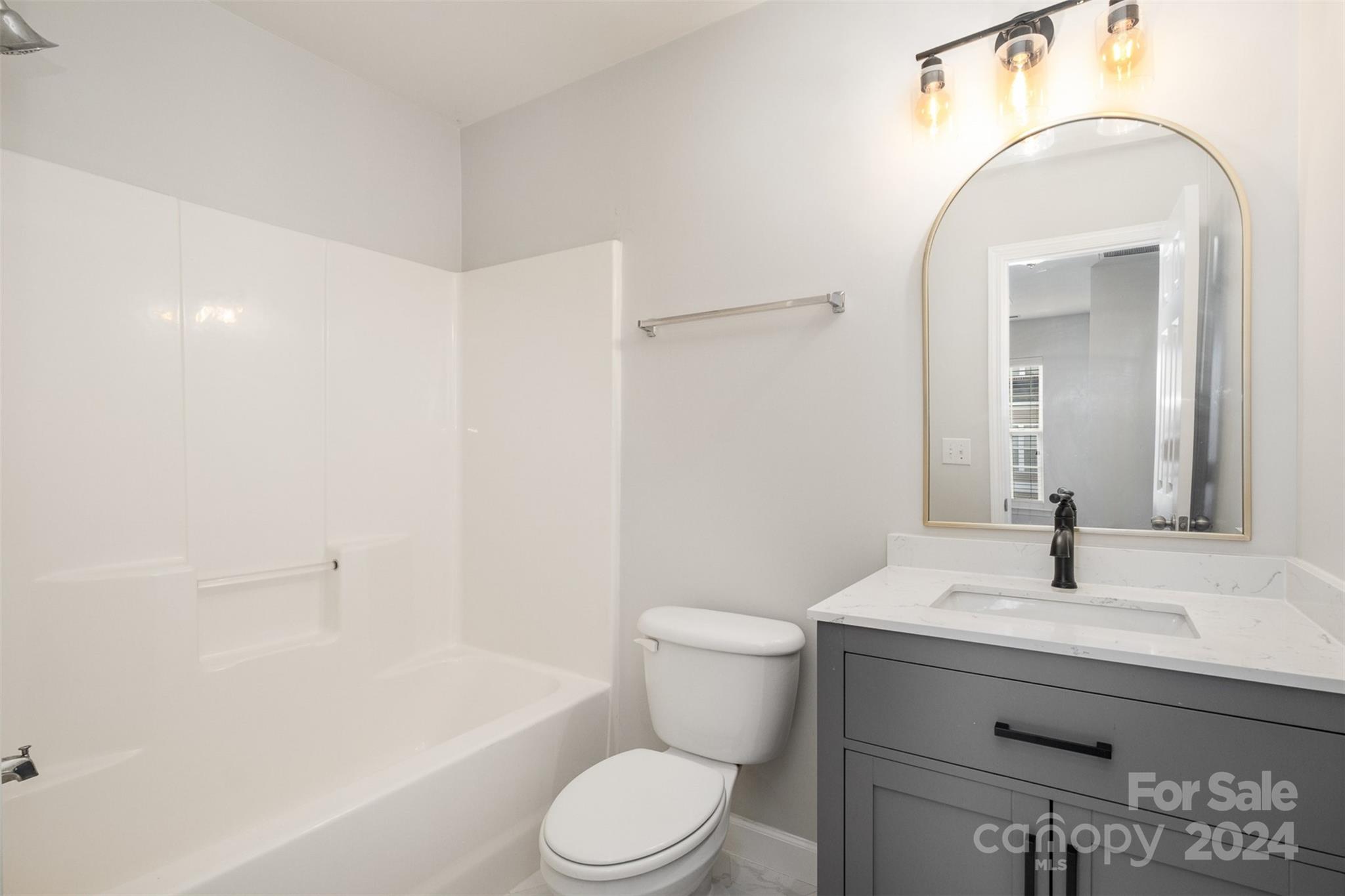 2149 Midnight Blue Lane Fort Mill, SC 29708 - Photo 27 of 30 a bathroom with a sink a toilet and shower