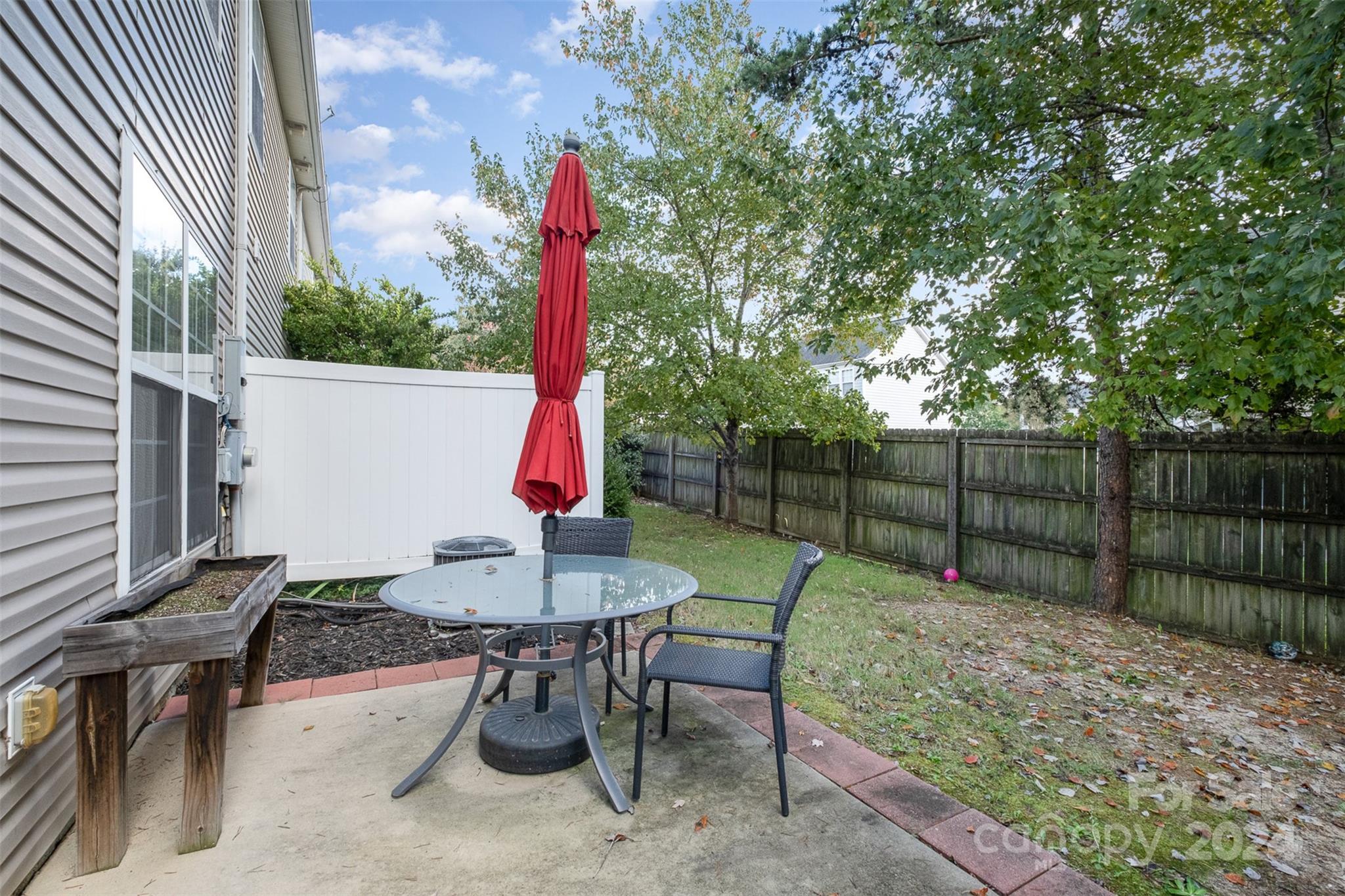 2149 Midnight Blue Lane Fort Mill, SC 29708 - Photo 29 of 30 a view of a sitting area with furniture and wooden fence