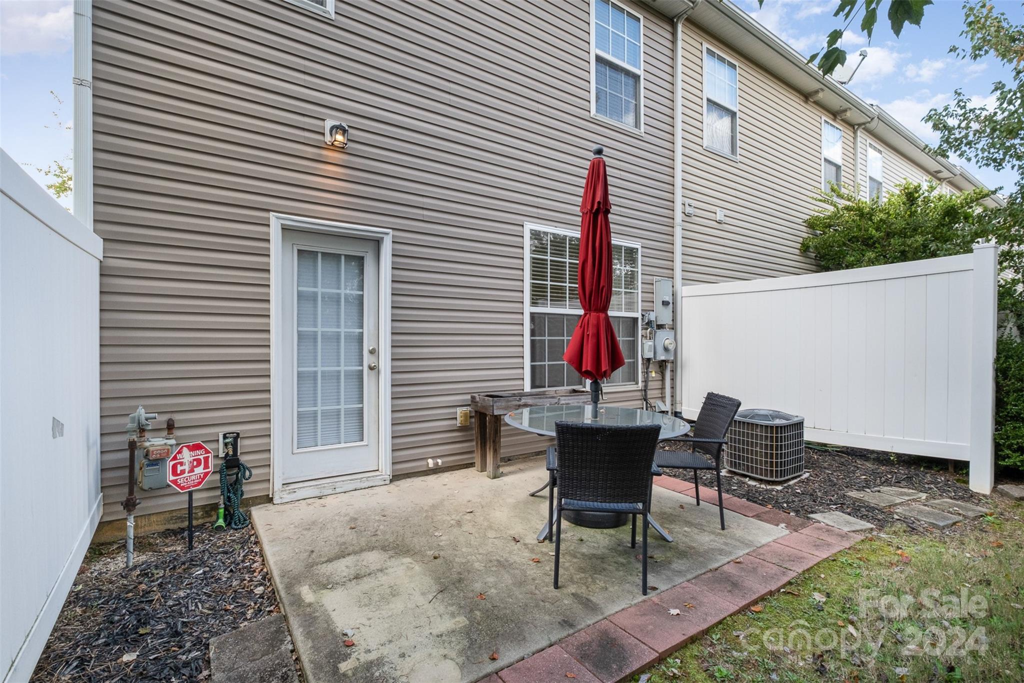 2149 Midnight Blue Lane Fort Mill, SC 29708 - Photo 30 of 30 a backyard of a house with table and chairs