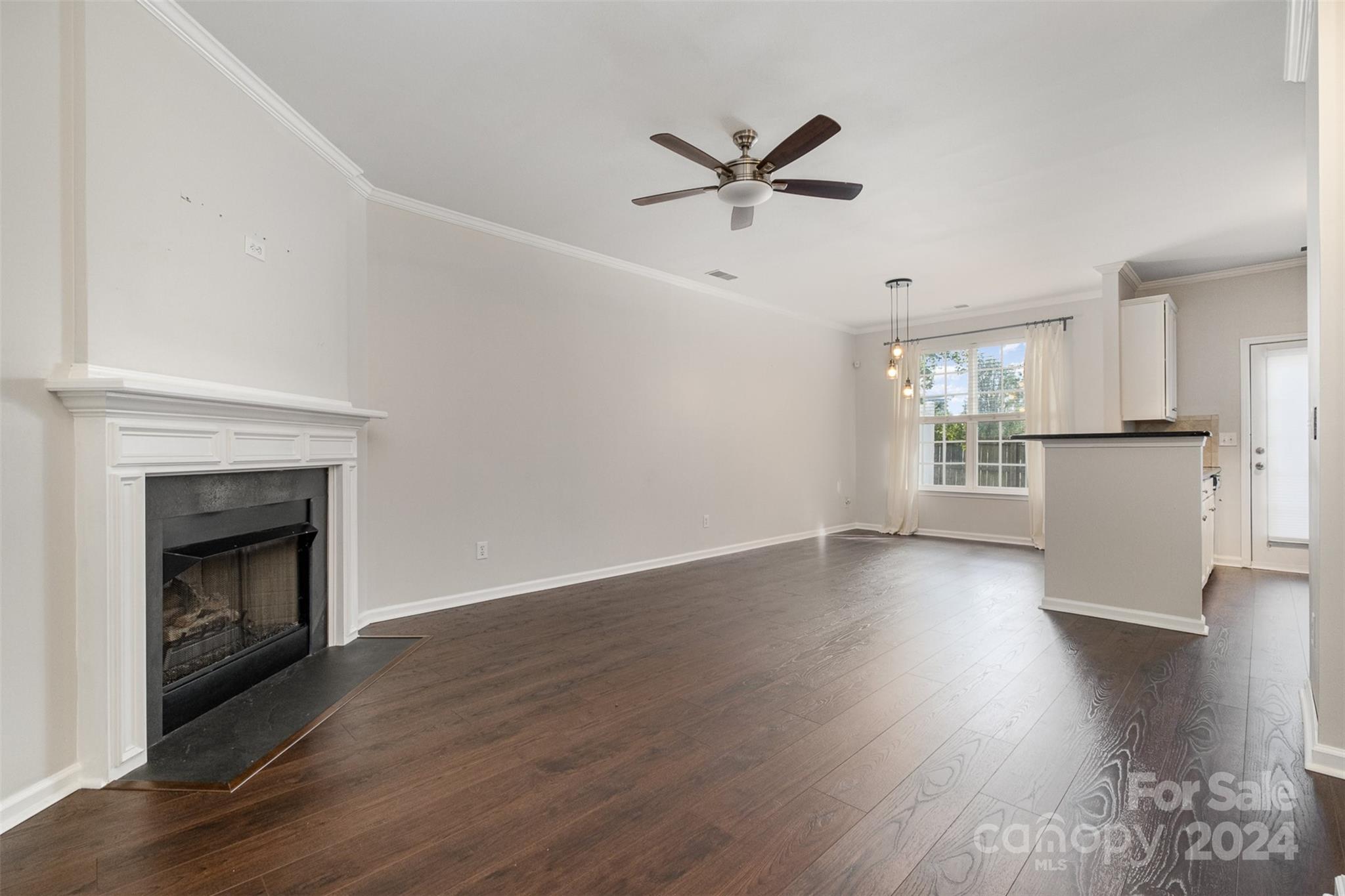 2149 Midnight Blue Lane Fort Mill, SC 29708 - Photo 4 of 30 a view of a room with wooden floor and a fireplace