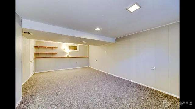 a view of an empty room with a fireplace