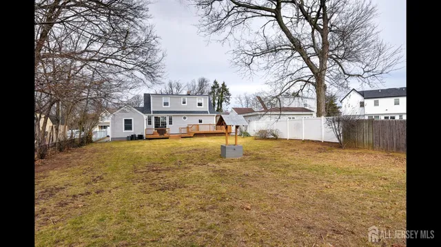 a front view of a house with a yard table and chairs