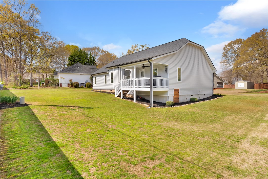 181 Amberwood Drive Anderson, SC 29621 - Photo 27 of 28 This spacious property features a charming exterior with a covered deck and a detached shed.