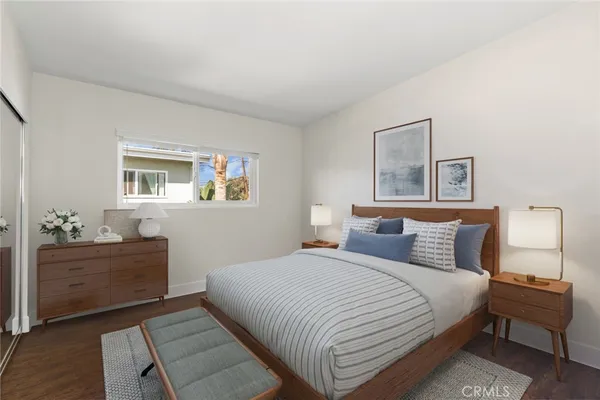 a bedroom with a bed and a cabinets