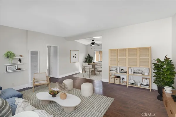 a living room with furniture and flowers