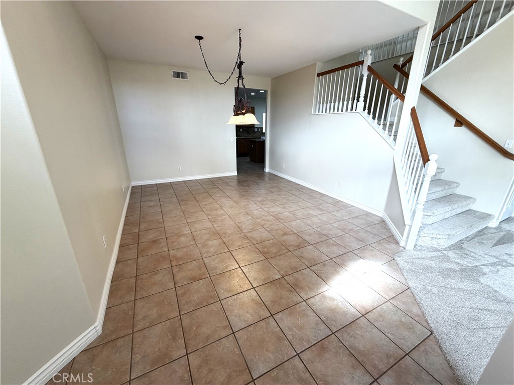 873 Greenridge Road Corona, CA 92882 - Photo 12 of 30 a view of a livingroom with a staircase