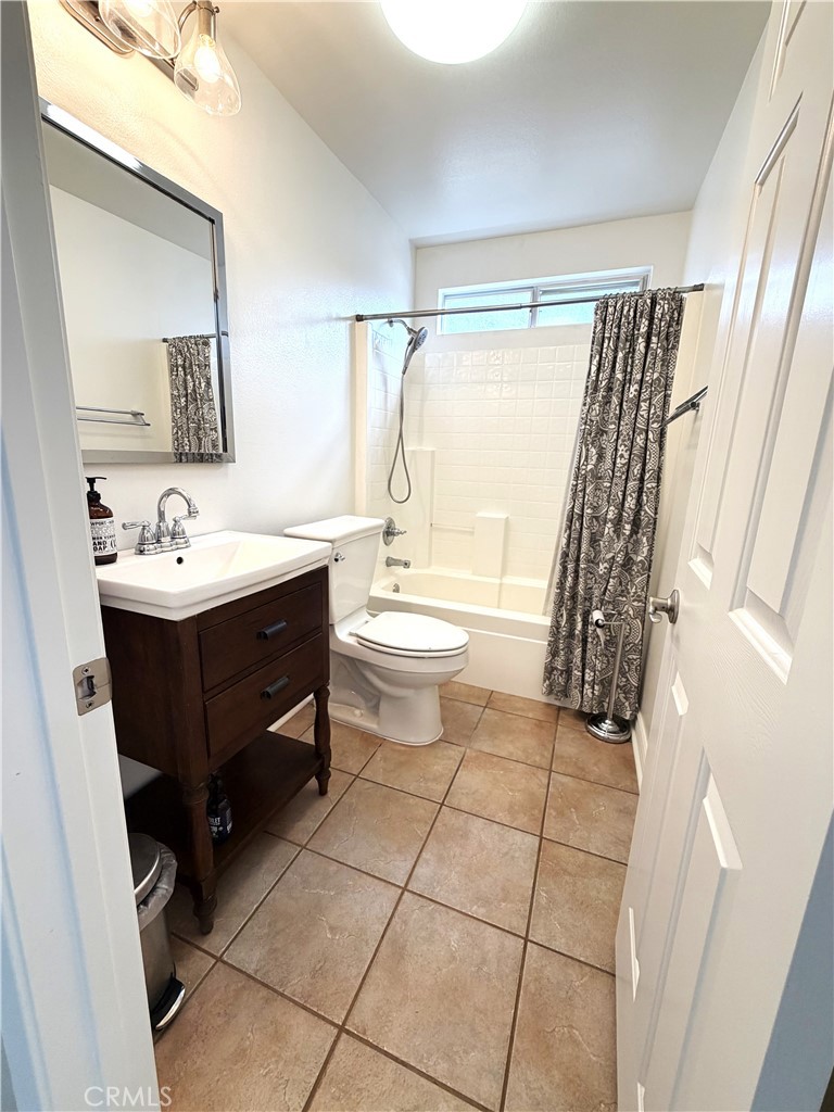 873 Greenridge Road Corona, CA 92882 - Photo 14 of 30 a bathroom with a sink a toilet and a mirror