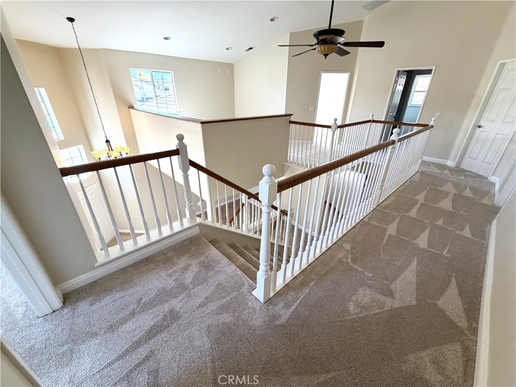 873 Greenridge Road Corona, CA 92882 - Photo 21 of 30 a view of a hallway with staircase