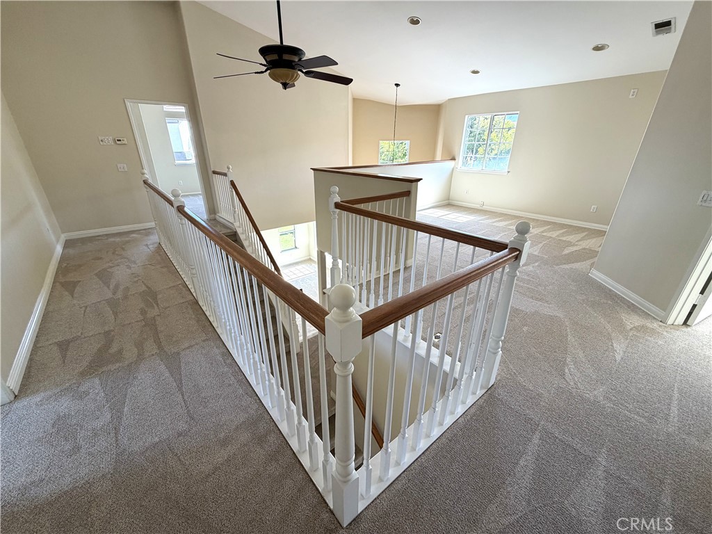 873 Greenridge Road Corona, CA 92882 - Photo 22 of 30 a view of a hallway with staircase